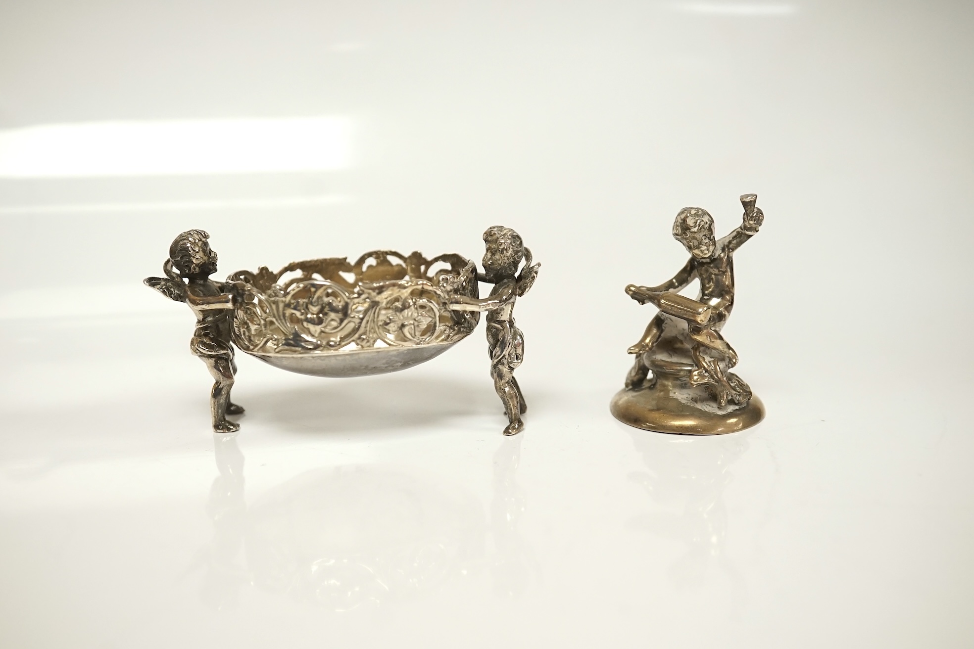 A collection of miniature silver and white metal figures and groups etc. including a swan sleigh, import marks for Chester, 1900, 41mm. Condition - poor to fair